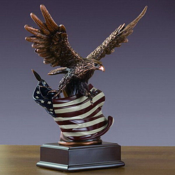 Eagle carrying American Flag Sculpture